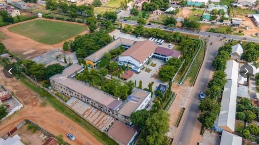Ahmadu Ribadu College Yola students in front of the historic school building.